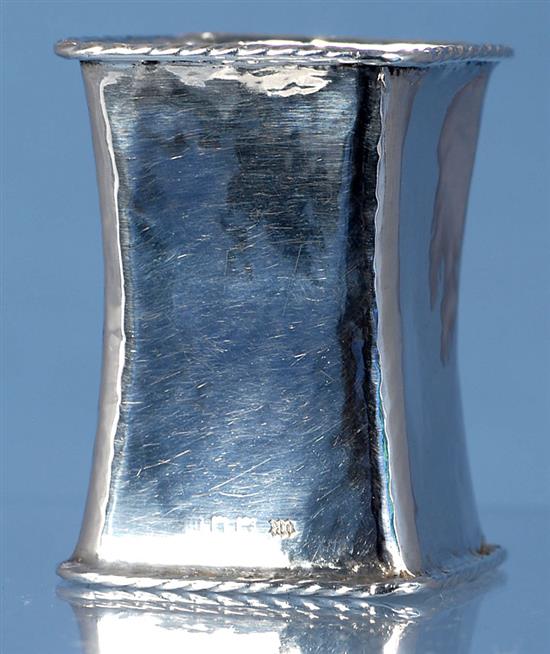 A George V Arts & Crafts planished silver waisted napkin ring, by Omar Ramsden, Height 60mm weight 1.3oz/42grms